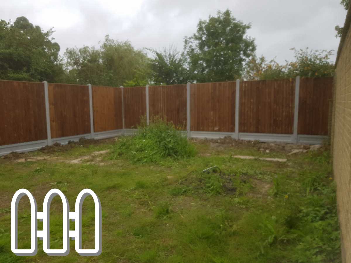 Newly installed wooden fence panels with concrete posts in a residential garden, with a natural backdrop and overgrown green grass.