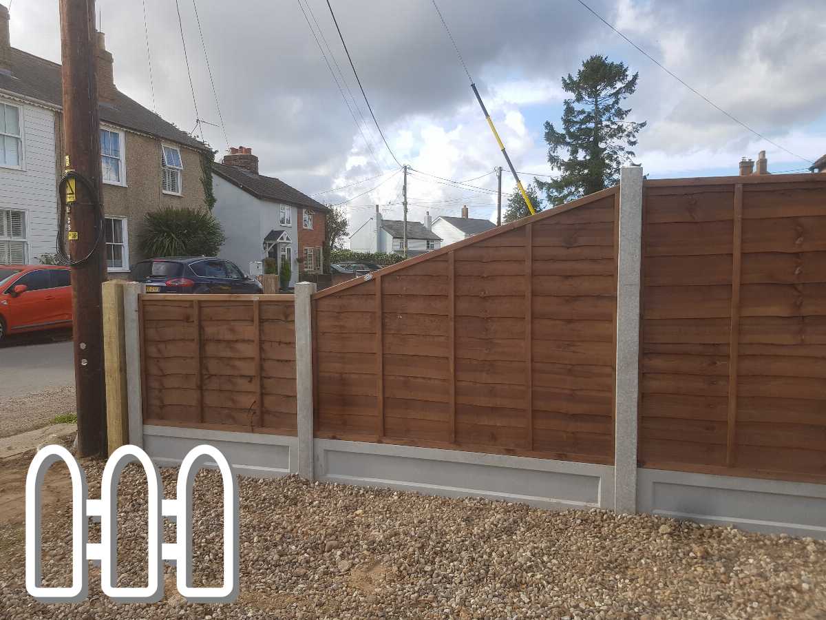 Newly installed wooden fencing with concrete posts along a suburban street, enhancing privacy and security for the home