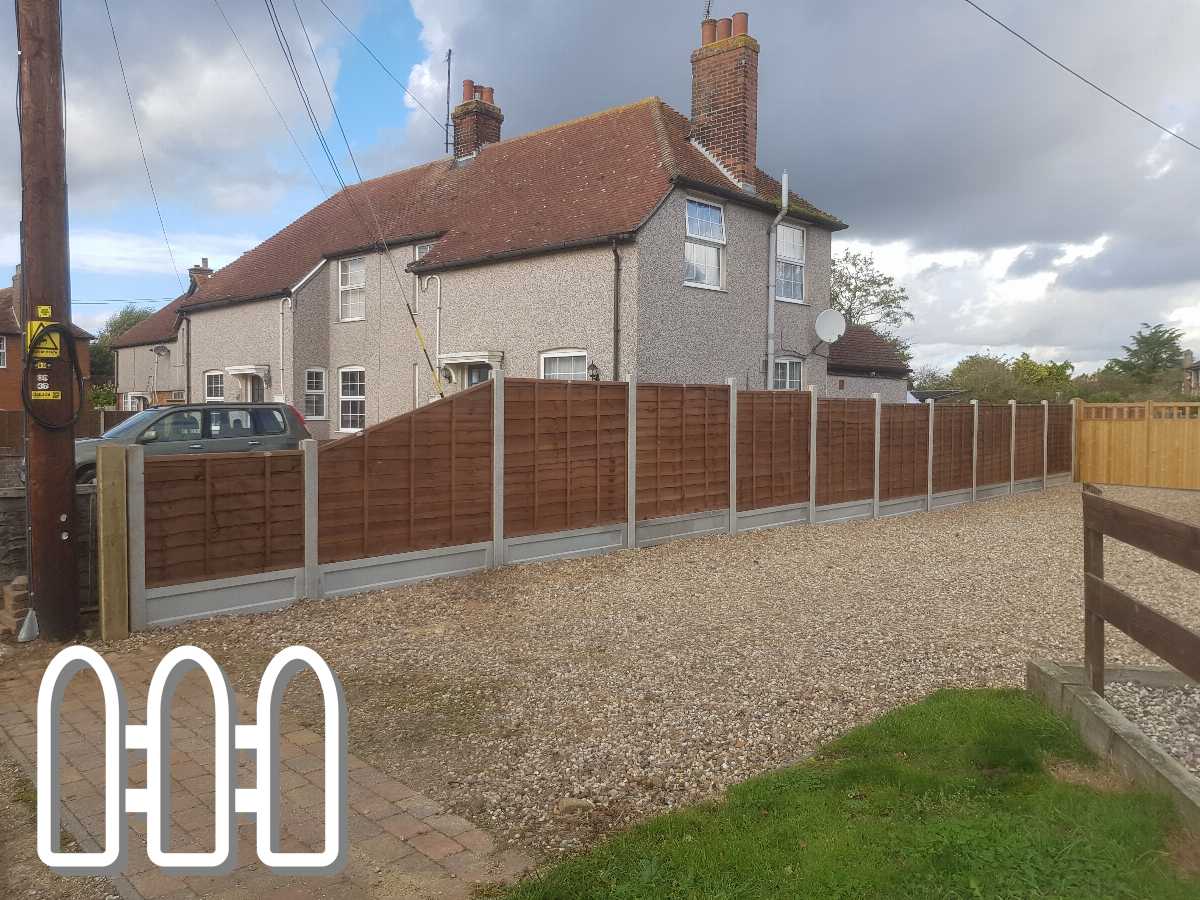 Sturdy wooden fence panels mounted on a concrete base, enhancing the privacy and security of a residential property