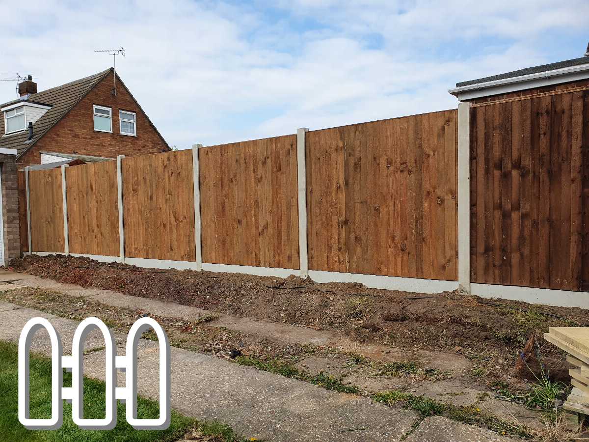 Newly installed brown wooden fence with concrete posts outside a residential house, enhancing privacy and security.